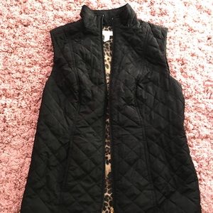 Black puffer vest with leopard print lining